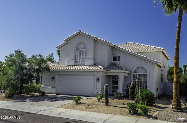 4530 E Desert Wind Dr, Phoenix, AZ 85044 - mediterranean / spanish house featuring driveway, a tile roof, and stucco siding