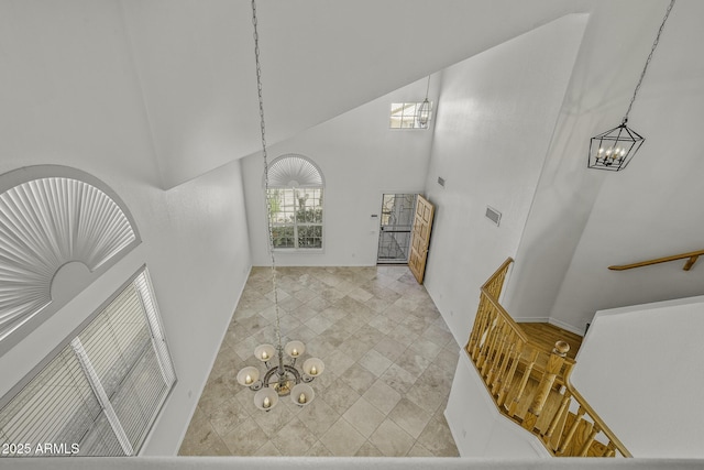 4530 E Desert Wind Dr, Phoenix, AZ 85044 - entrance foyer featuring a chandelier and high vaulted ceiling