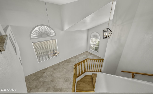 4530 E Desert Wind Dr, Phoenix, AZ 85044 - stairs with a chandelier and a towering ceiling