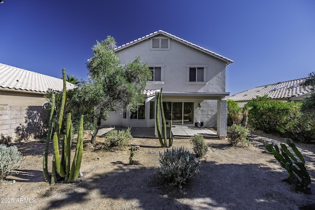 4530 E Desert Wind Dr, Phoenix, AZ 85044 - back of house with a patio, stucco siding, and a tile roof