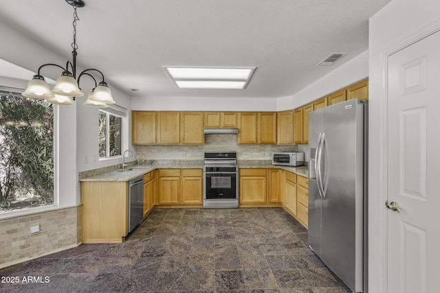 4530 E Desert Wind Dr, Phoenix, AZ 85044 - kitchen with stainless steel appliances, a sink, under cabinet range hood, a chandelier, and light stone countertops