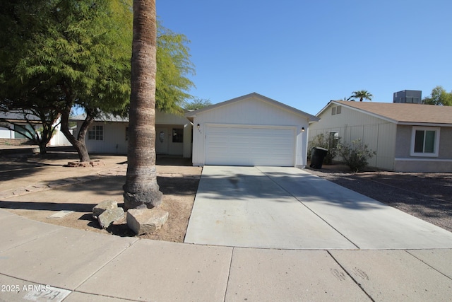 ranch-style home featuring a garage