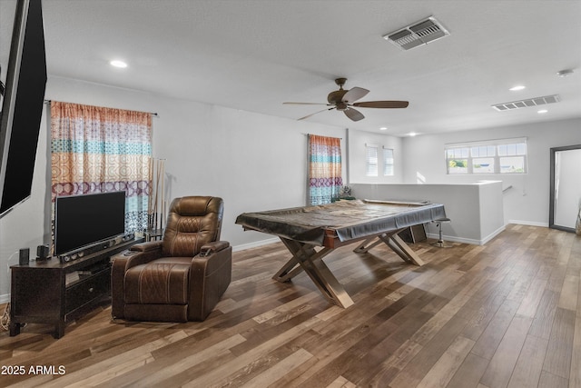 playroom with hardwood / wood-style flooring and ceiling fan