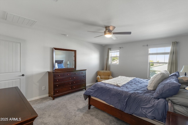 bedroom featuring light colored carpet and ceiling fan