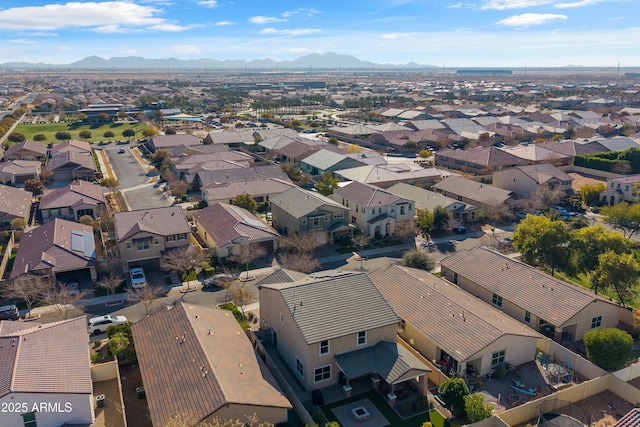 birds eye view of property with a mountain view