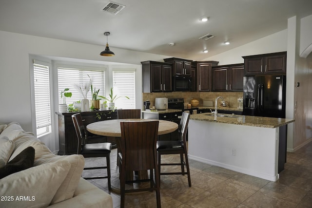 2930 W La Salle St, Phoenix, AZ 85041 - kitchen featuring decorative backsplash, a sink, black appliances, and visible vents