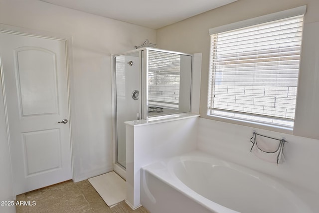 2930 W La Salle St, Phoenix, AZ 85041 - bathroom featuring a garden tub, a wealth of natural light, and a stall shower