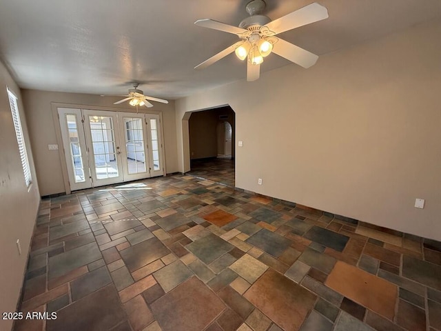 spare room featuring french doors and ceiling fan