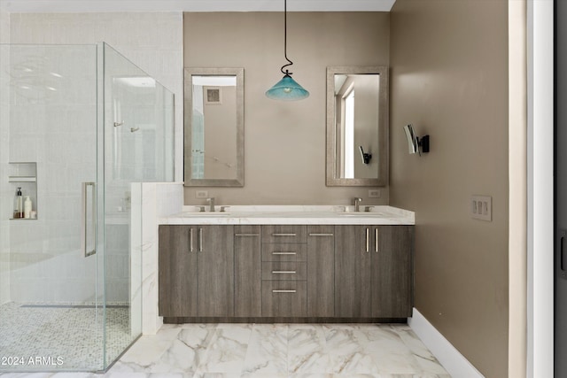 bathroom featuring vanity and a shower with shower door