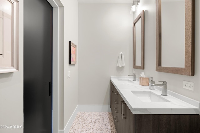 6525 E Cave Creek Rd Unit 6, Cave Creek, AZ 85331 - full bathroom featuring double vanity, a sink, and baseboards