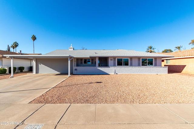 ranch-style house featuring a garage