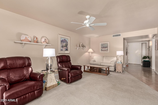 living room with carpet floors and ceiling fan