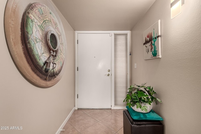 doorway featuring light tile patterned floors