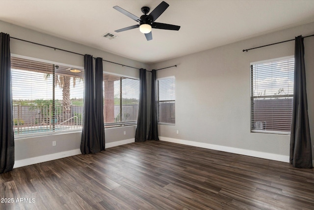 2761 W Via Calabria, Phoenix, AZ 85086 - unfurnished room with baseboards, wood finished floors, and ceiling fan