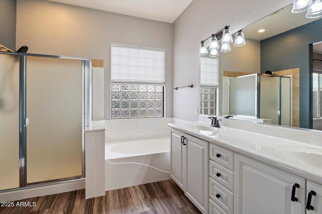 2761 W Via Calabria, Phoenix, AZ 85086 - bathroom with a shower stall, healthy amount of natural light, a garden tub, and double vanity