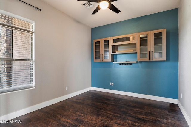 2761 W Via Calabria, Phoenix, AZ 85086 - spare room featuring a ceiling fan, dark wood finished floors, and baseboards