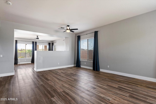 2761 W Via Calabria, Phoenix, AZ 85086 - spare room with baseboards, a ceiling fan, dark wood-style flooring, and a smoke detector