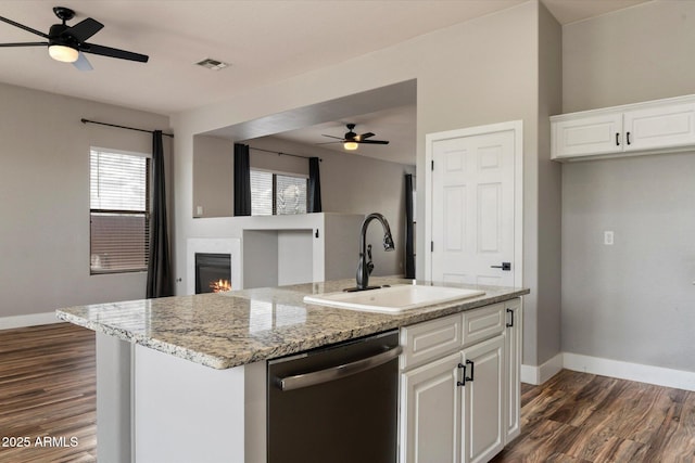 2761 W Via Calabria, Phoenix, AZ 85086 - kitchen featuring stainless steel dishwasher, a sink, dark wood-type flooring, baseboards, and open floor plan
