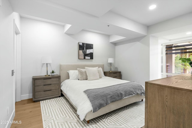 bedroom with recessed lighting, baseboards, and light wood finished floors