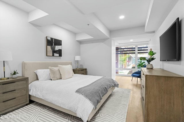 bedroom featuring light wood finished floors and recessed lighting