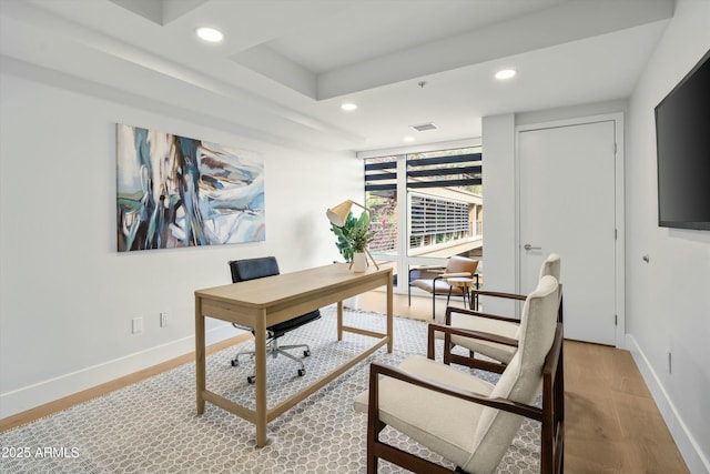 home office featuring light wood-type flooring, baseboards, and recessed lighting