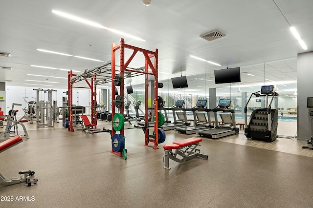 exercise room featuring visible vents