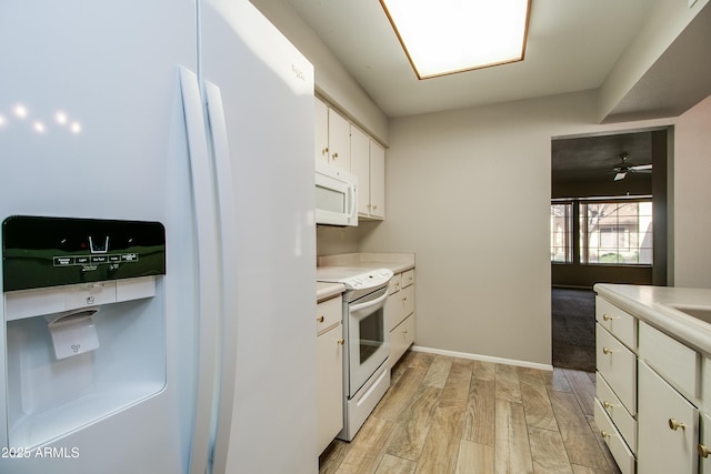 kitchen featuring ceiling fan, white appliances, light hardwood / wood-style floors, and white cabinets