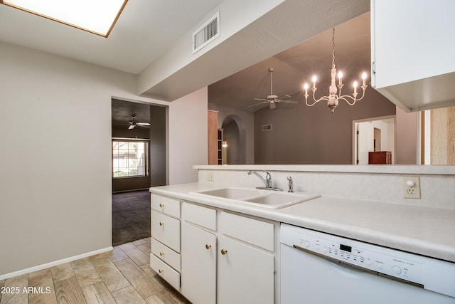 kitchen with white cabinetry, white dishwasher, sink, and pendant lighting