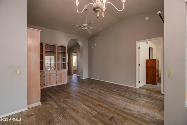 interior space with lofted ceiling, dark hardwood / wood-style floors, and ceiling fan