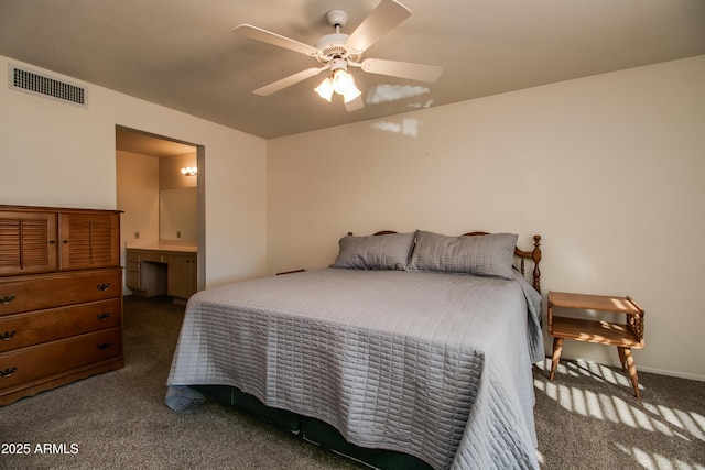 carpeted bedroom featuring ensuite bath and ceiling fan