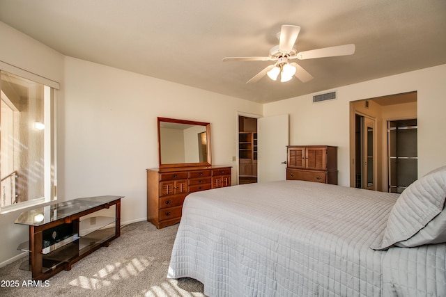 bedroom featuring light carpet and ceiling fan