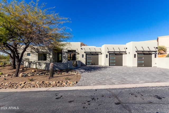 adobe home featuring a garage