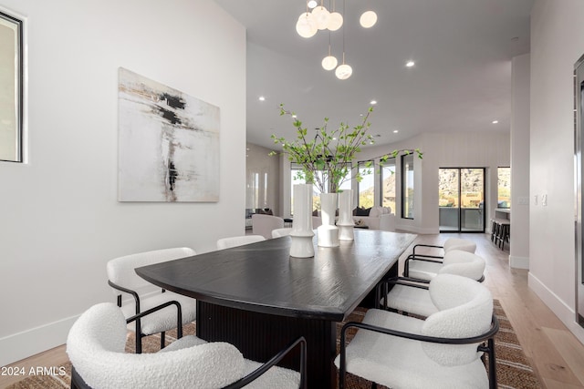 dining area with light hardwood / wood-style floors