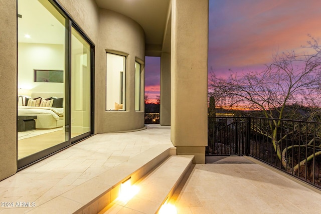 view of balcony at dusk