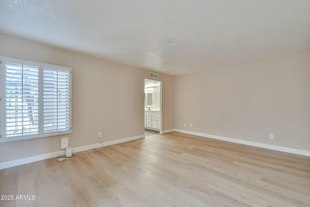 empty room featuring light hardwood / wood-style floors