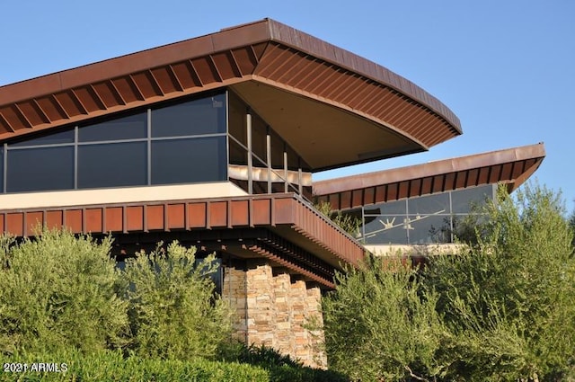 view of side of property featuring stone siding