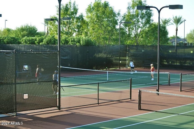 view of sport court with fence