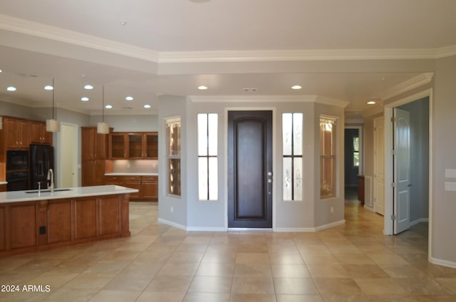 entrance foyer with baseboards, ornamental molding, and recessed lighting