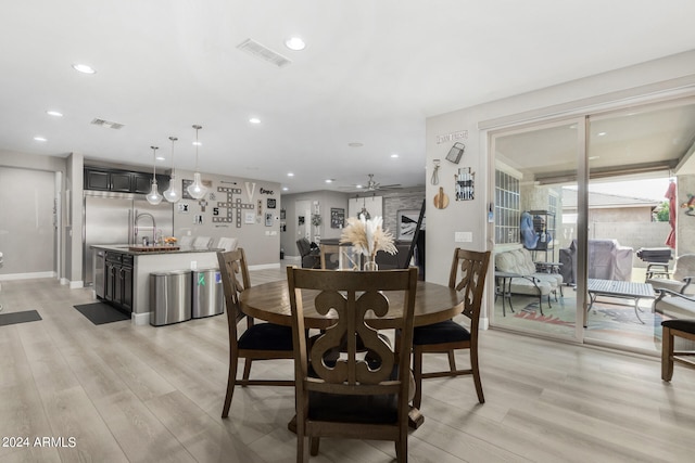 dining area featuring ceiling fan and light hardwood / wood-style floors