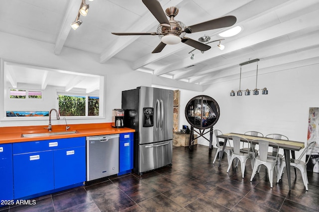 1029 E Palo Verde Dr, Phoenix, AZ 85014 - kitchen with stainless steel appliances, blue cabinets, track lighting, a sink, and beamed ceiling