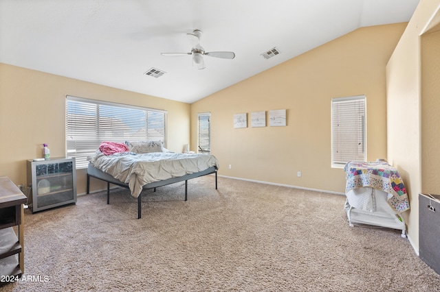 bedroom with ceiling fan, carpet, and vaulted ceiling