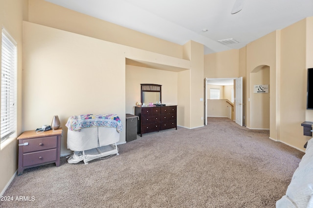 bedroom featuring light colored carpet