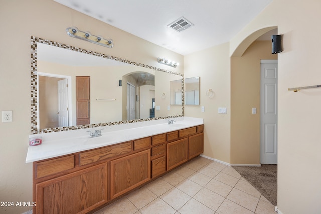 bathroom with tile patterned floors and vanity