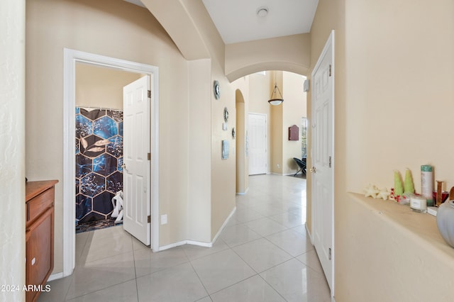 corridor with light tile patterned flooring