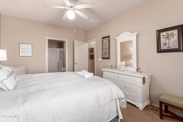 bedroom with a ceiling fan, visible vents, baseboards, ensuite bath, and carpet flooring