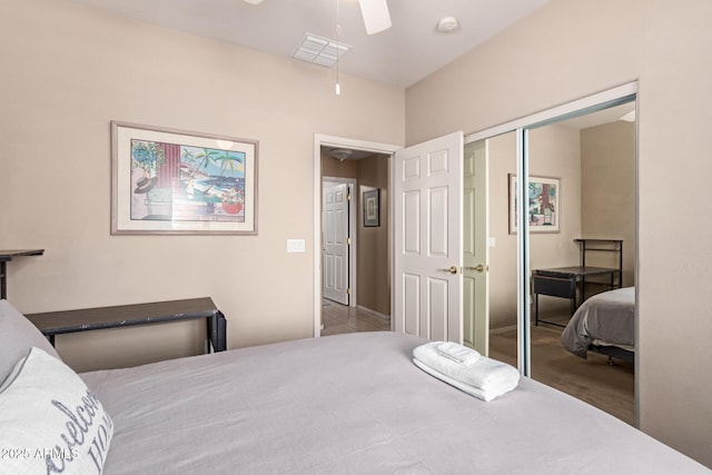 bedroom with a closet, visible vents, and a ceiling fan