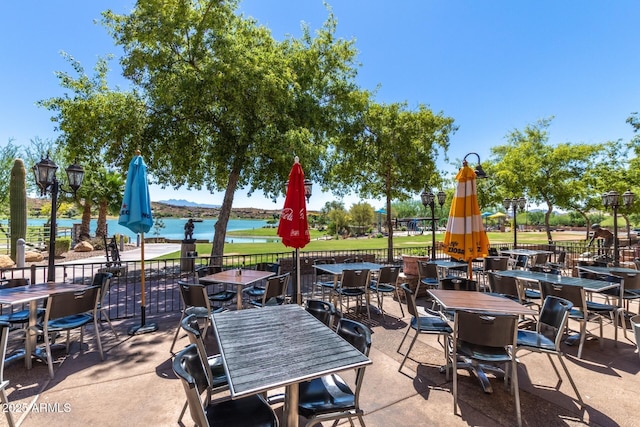 view of patio featuring a water view