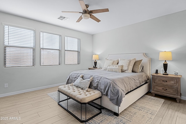 bedroom with ceiling fan and light hardwood / wood-style flooring