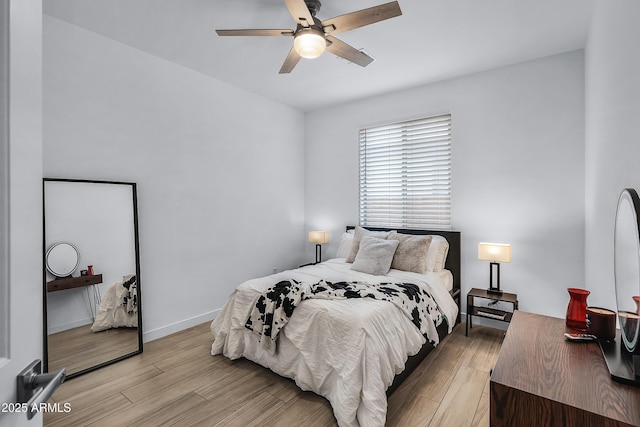 bedroom featuring light wood-type flooring and ceiling fan