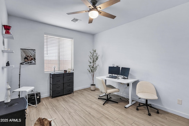 office space featuring light hardwood / wood-style flooring and ceiling fan